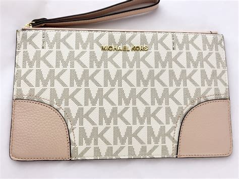 michael kors small wallet pink|Michael Kors pink wristlet wallet.